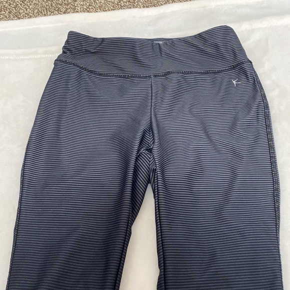 Dansko black and grey striped leggings. Cute detail of tear drop cutouts on legs - Picture 4 of 6